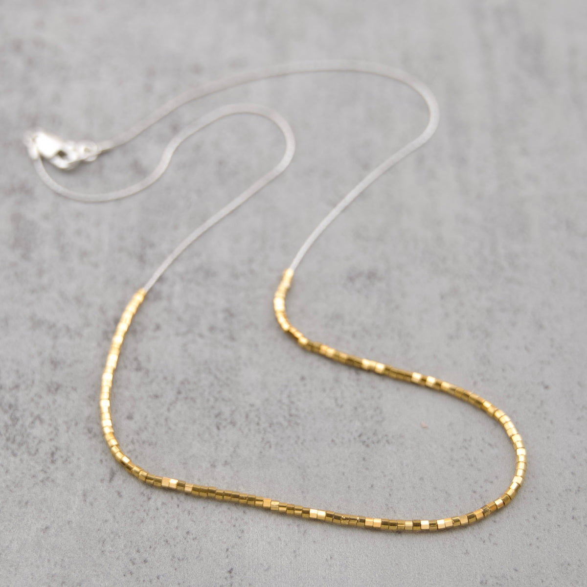 Sterling silver chain and sparkling 24k gold plated Japanese Glass slider beaded necklace