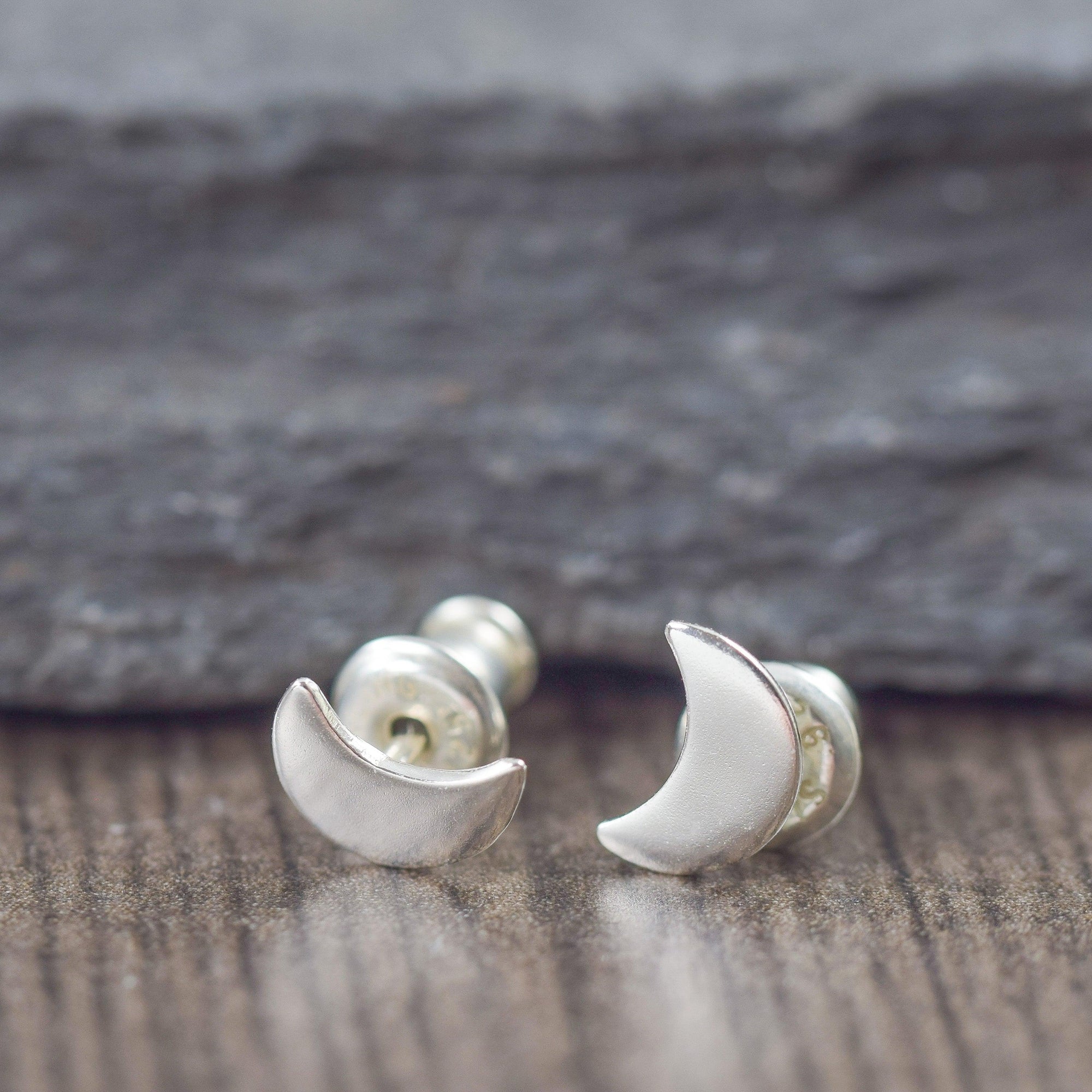 Crescent moon stud earrings in sterling silver
