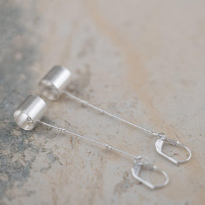 Long sterling silver dangle spinner earrings