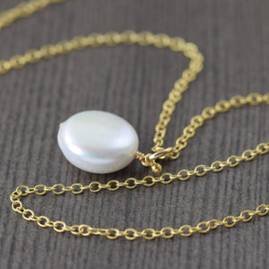 White freshwater pearl necklace on gold filled chain coin shape